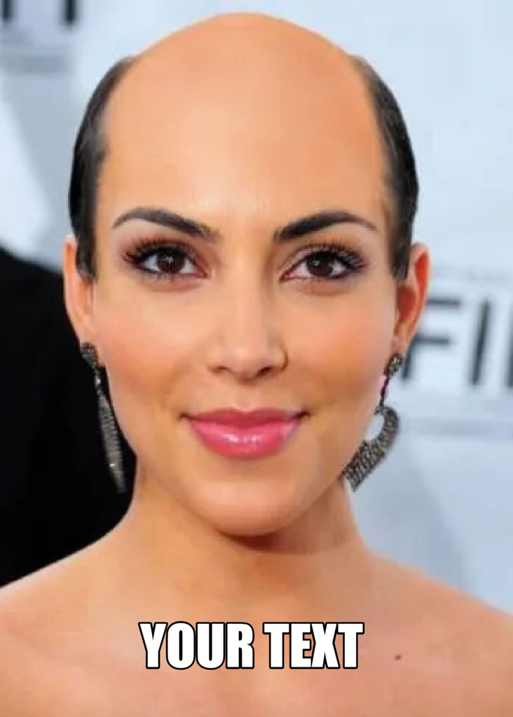 Close-up of a smiling woman with a bald head and dangling earrings