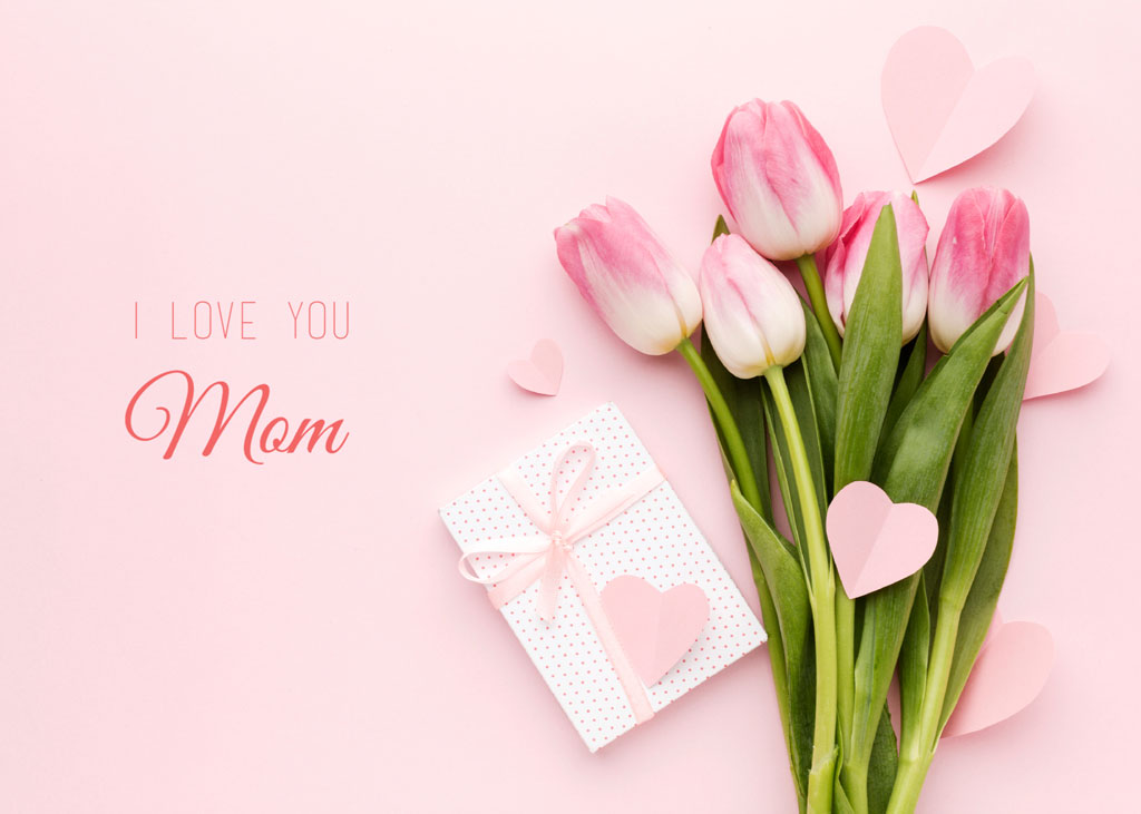 Pink tulips and gift box with heart on pink background