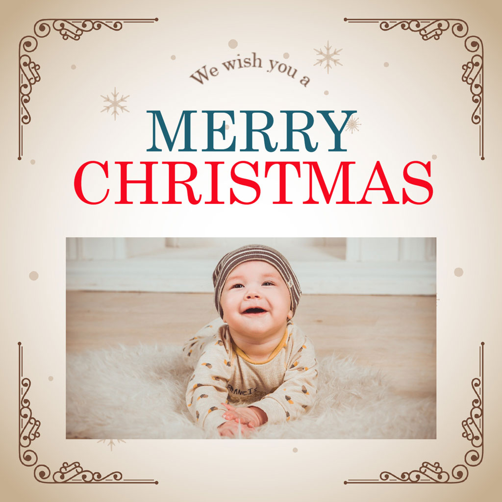 Baby lying on a fluffy surface, smiling, with 'Merry Christmas' text above