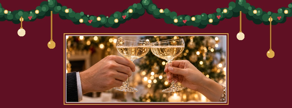 Champagne glasses clinking beneath a green garland with ornaments and warm lights.