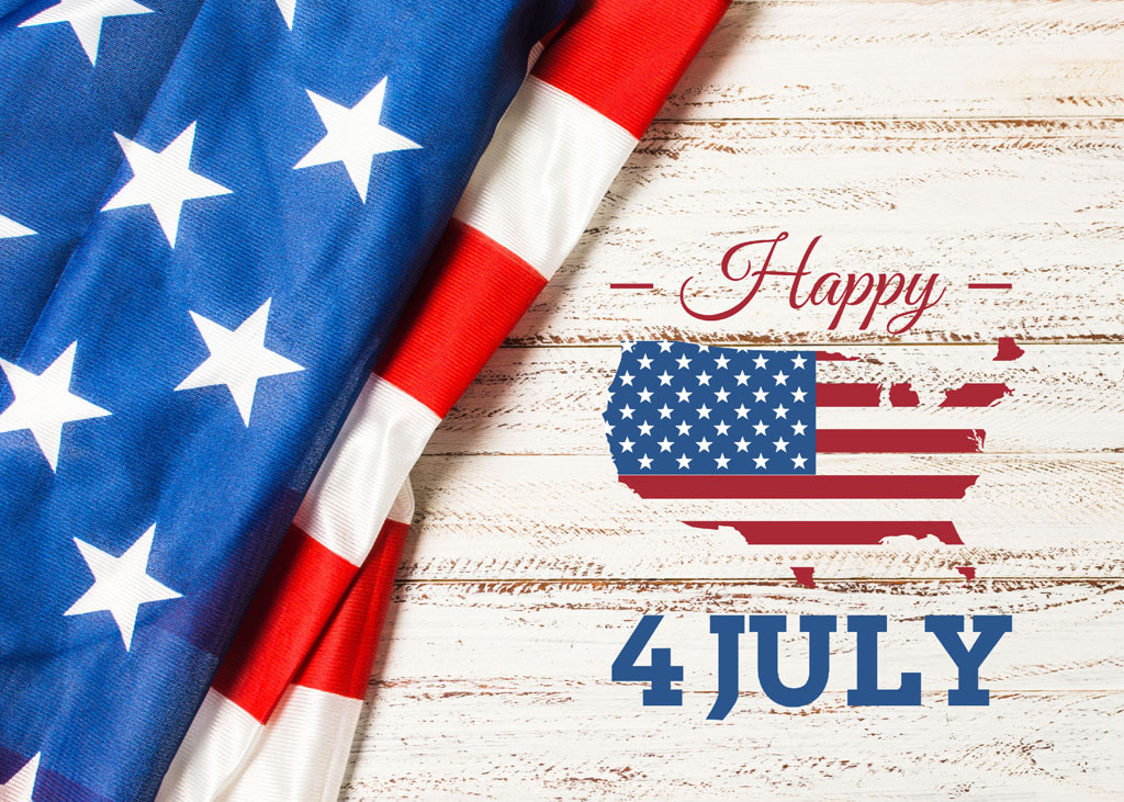 American flag on a wooden background with Happy 4 July text