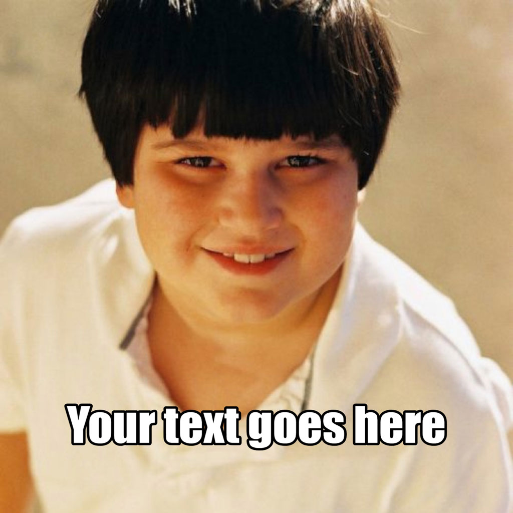 A smiling young boy with short dark hair and a white shirt