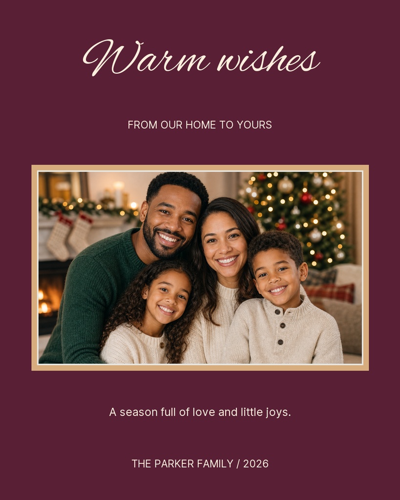 Family portrait on a burgundy holiday greeting card with warm wishes text.