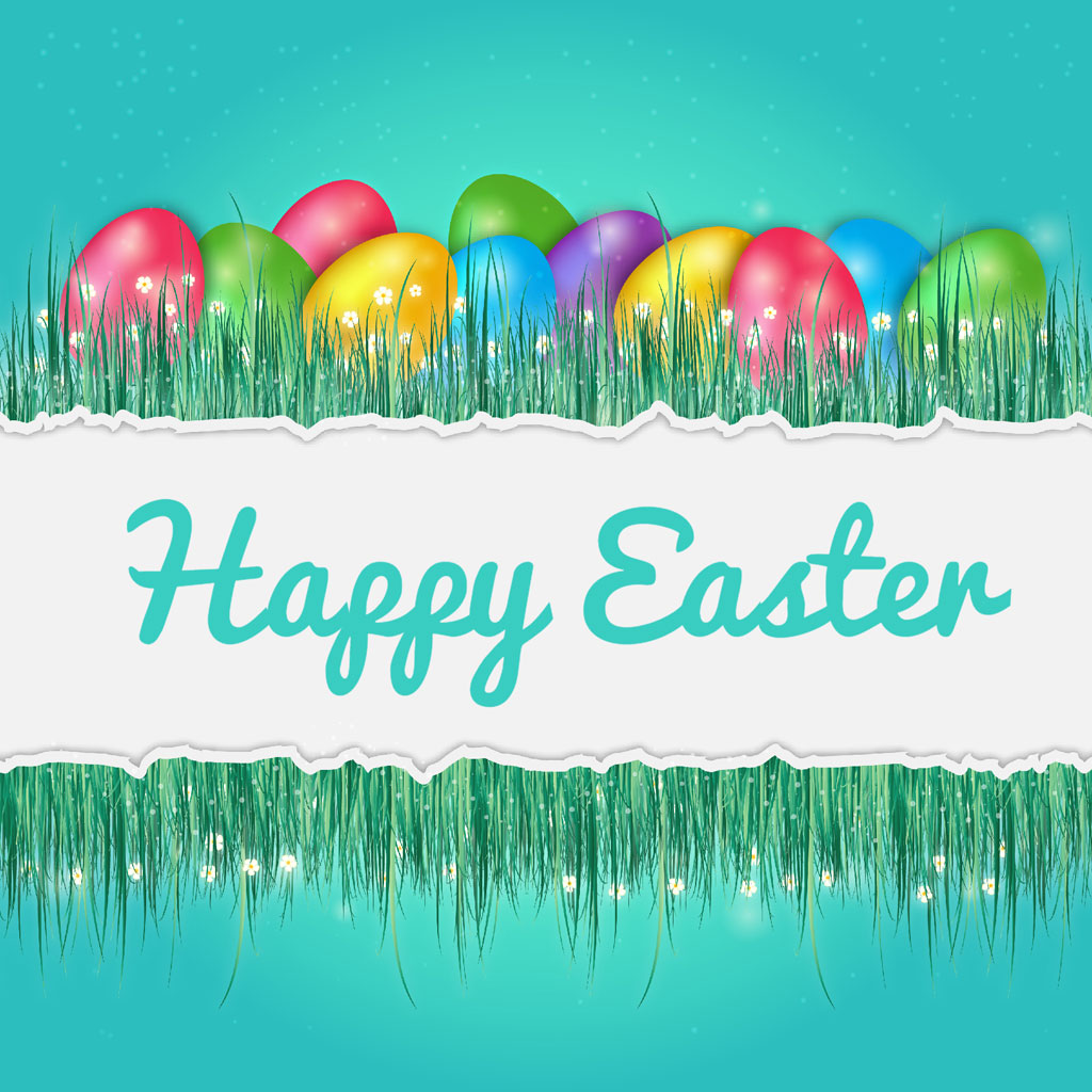 Colorful Easter eggs in grass with Happy Easter text