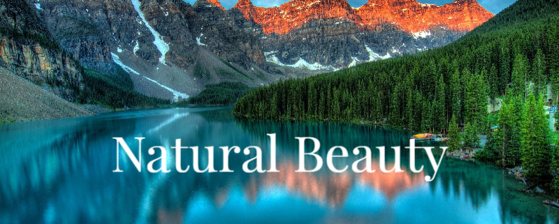 A serene lake surrounded by mountains and lush greenery