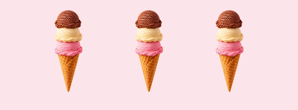 Three stacked ice cream cones on a light pink background.