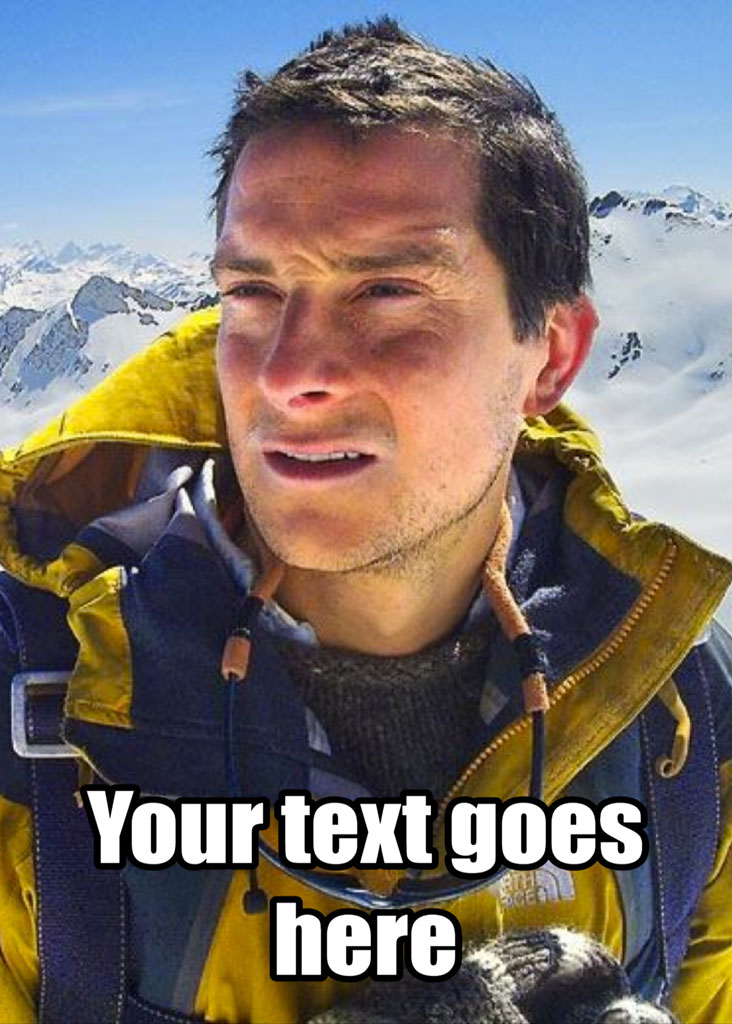 Man in yellow and blue winter jacket with snowy mountains behind
