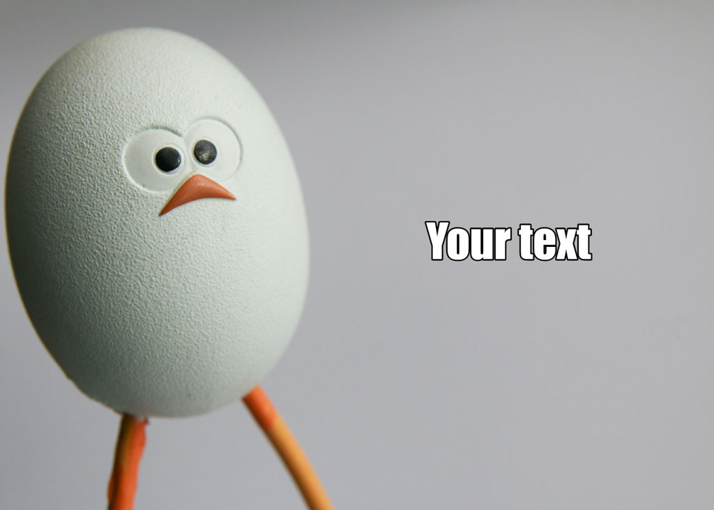 An egg with a face and orange legs on a gray background