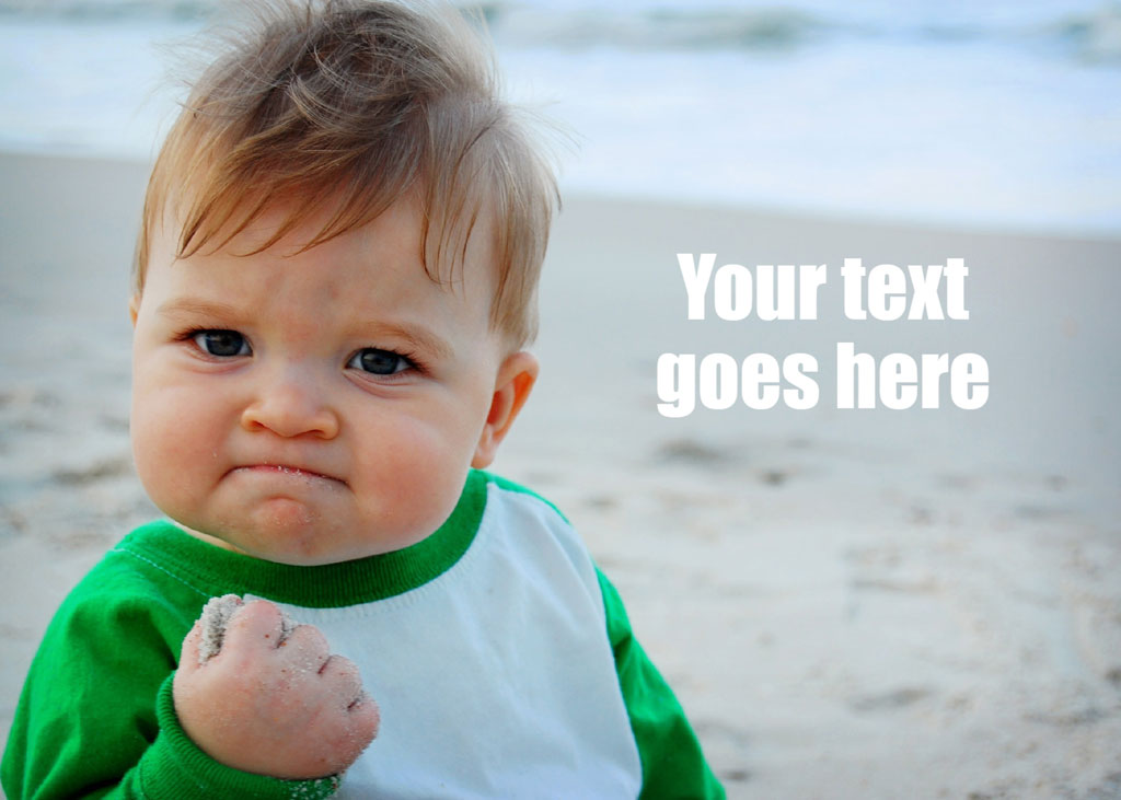 Baby with a frown holding sand