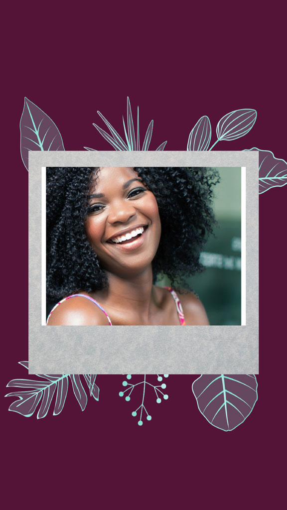 A smiling woman with curly hair