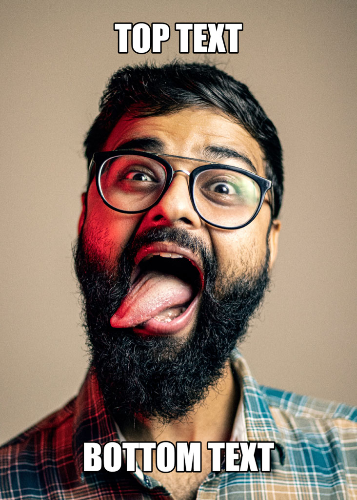 Man with beard and glasses sticking out his tongue in surprise