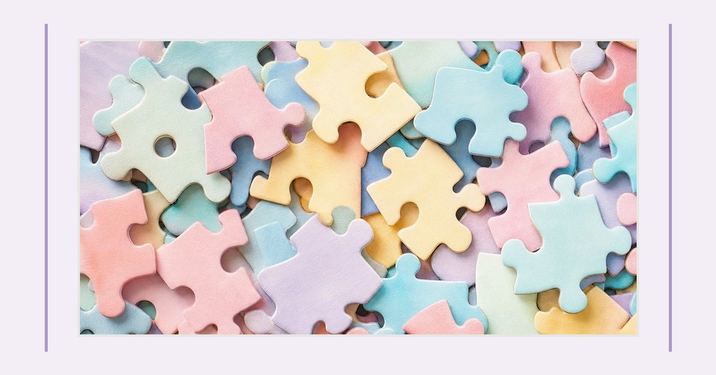 Pastel puzzle pieces arranged together in a colorful landscape design