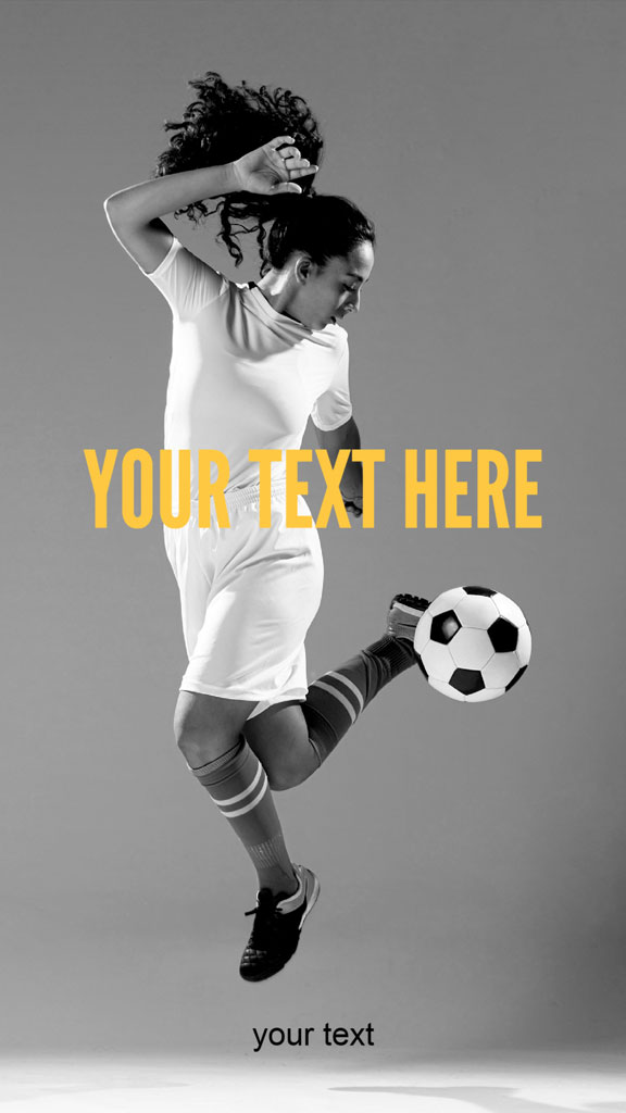 A woman soccer player kicking a soccer ball