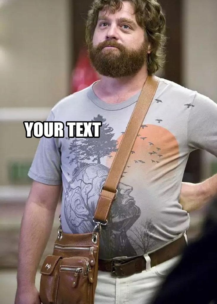 Man with curly hair and beard wearing a gray graphic t-shirt and a brown messenger bag