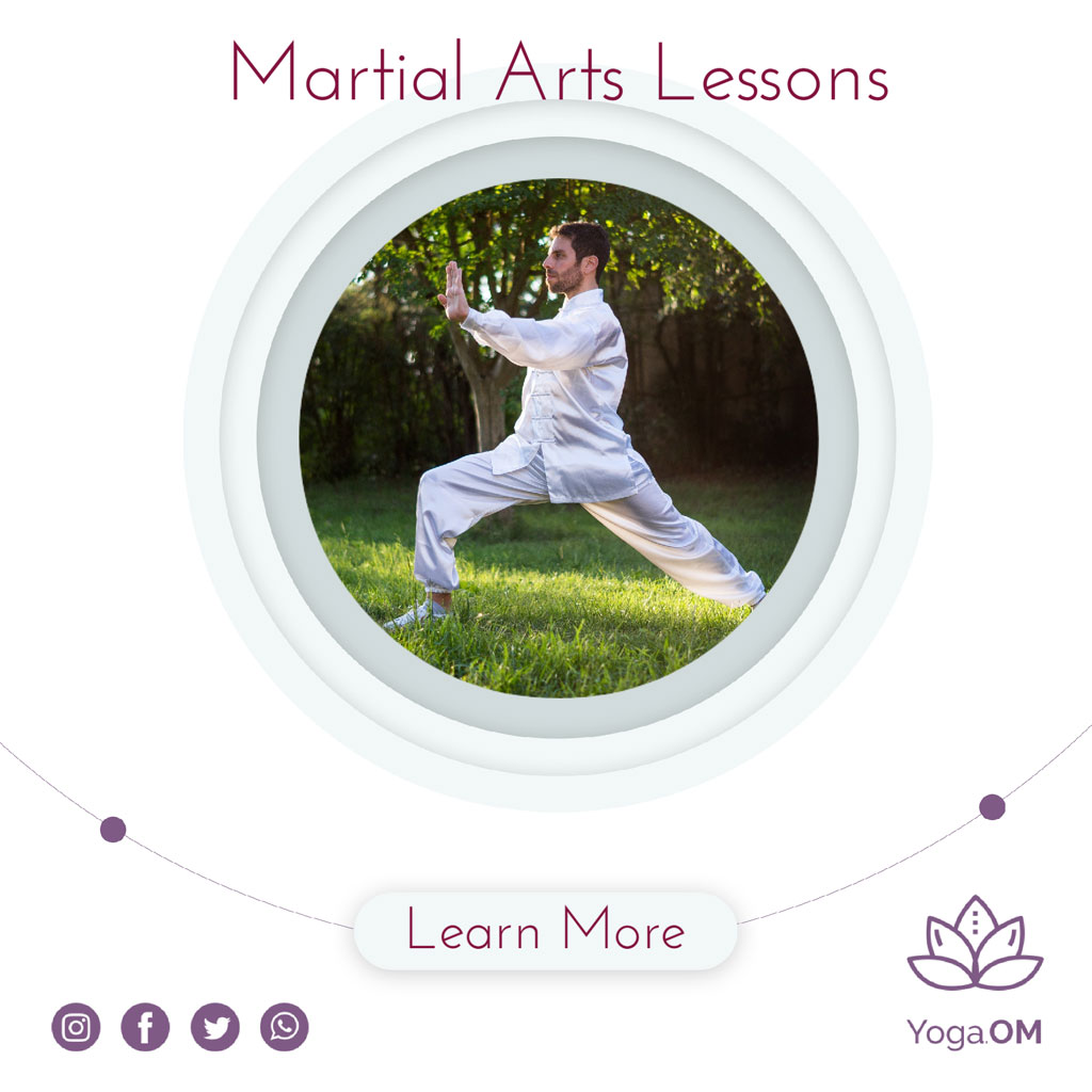 Man practicing martial arts in a serene outdoor setting