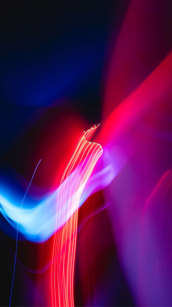 Colorful light trails on a dark background