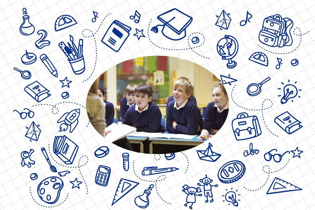 Students in a classroom with school supplies around them