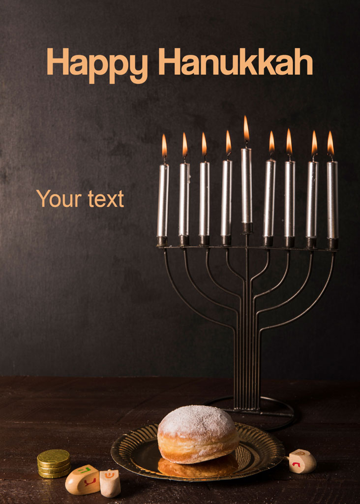 Hanukkah menorah with lit candles and a plate of sufganiyot