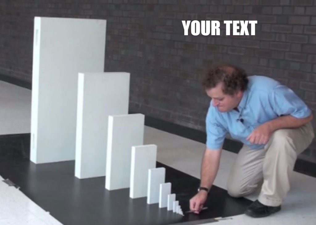 Man in blue shirt arranging white blocks