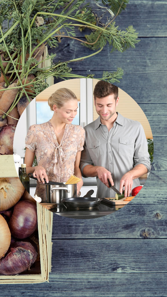 A man and woman cooking together in a kitchen.