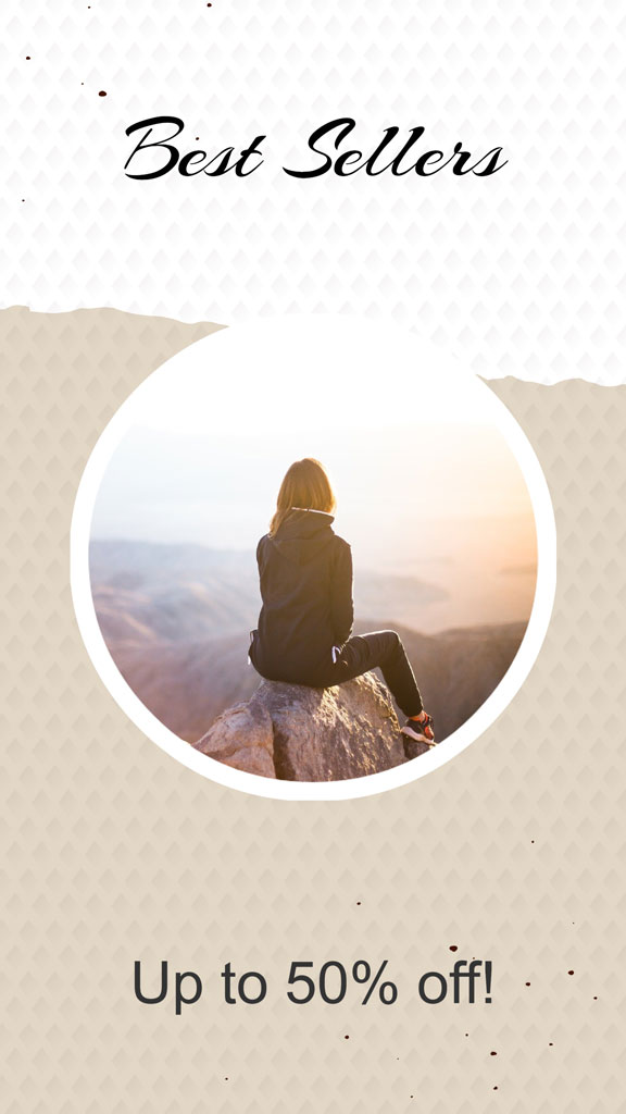 Woman sitting on a rock overlooking a mountainous landscape