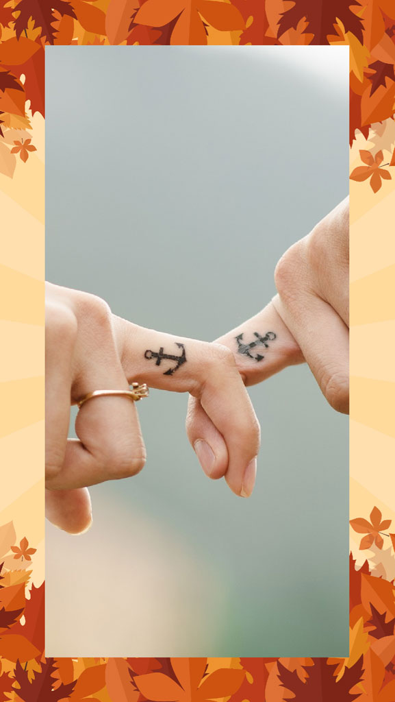 Two hands with anchor tattoos touching pinkies