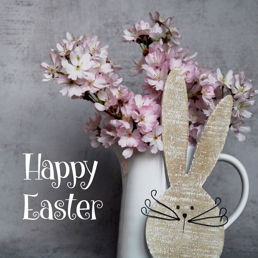 Easter greeting with pink flowers and bunny decoration
