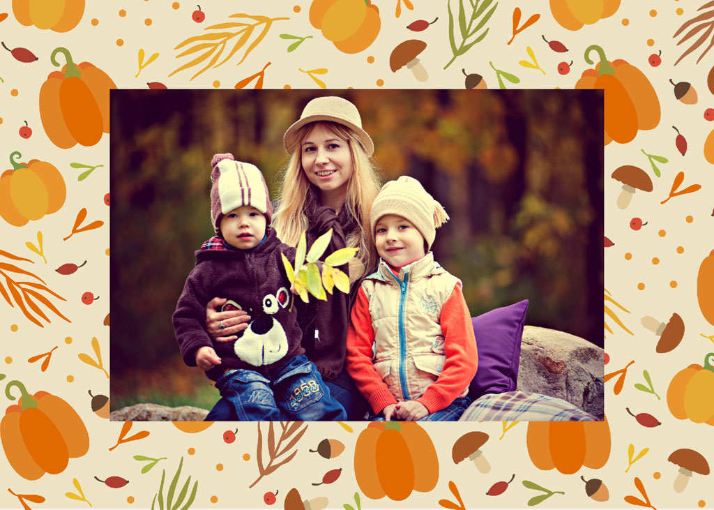 Woman and two children sitting outdoors in autumn attire