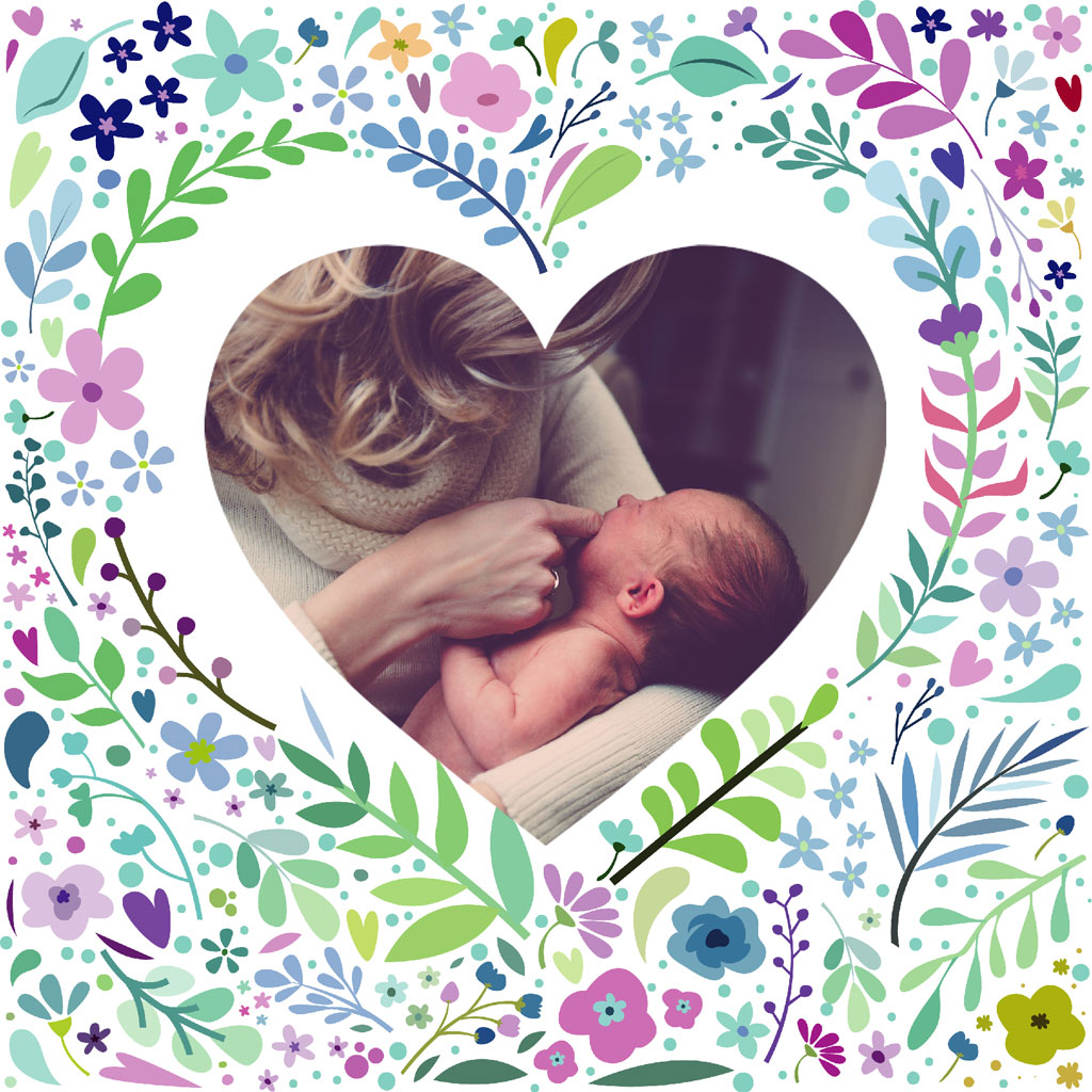 Mother holding her newborn baby in a heart-shaped frame surrounded by flowers
