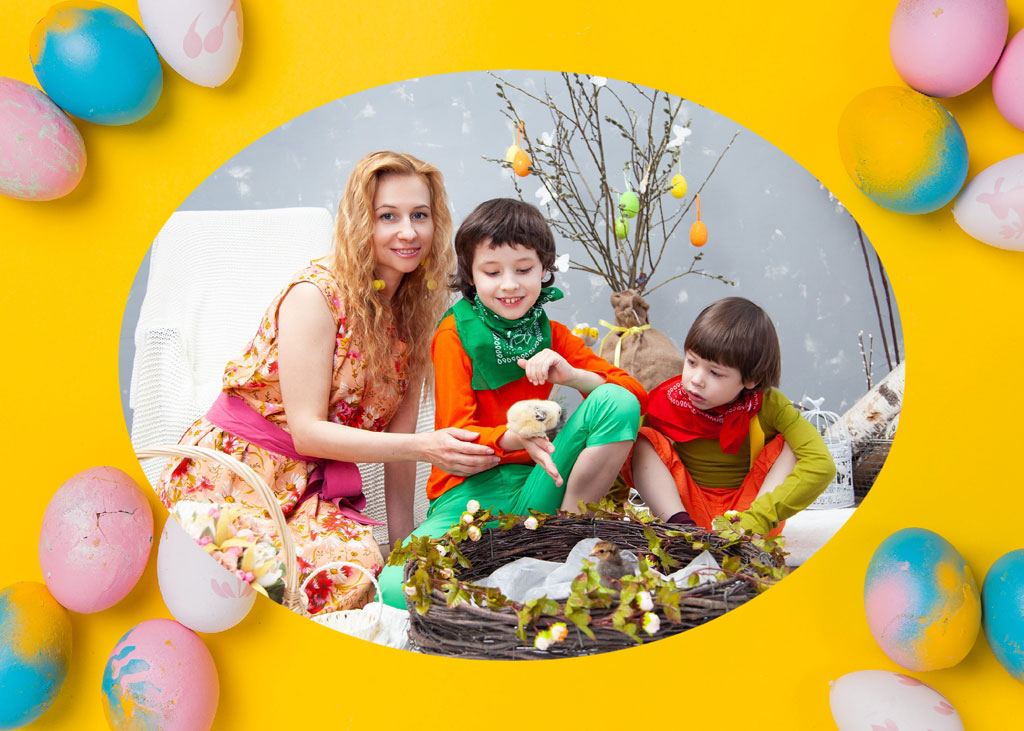 Mother and two children in Easter attire with decorated eggs