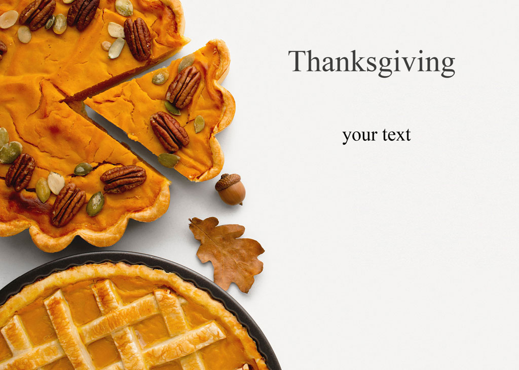 Two pumpkin pies with pecans and pumpkin seeds