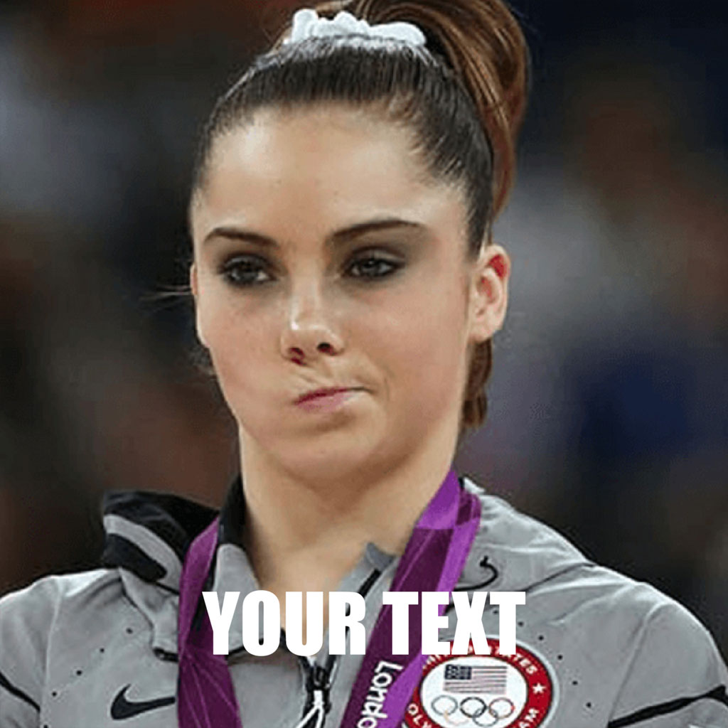 A young woman with a medal around her neck, wearing a gray Nike jacket with an Olympic logo.