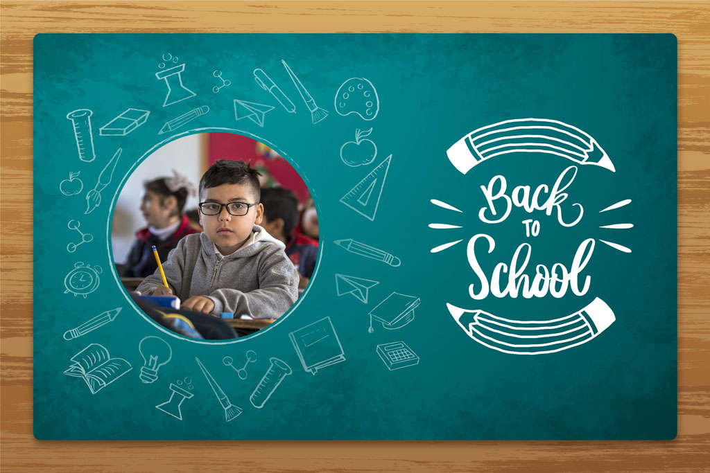 A young boy writing on a notebook with a pencil, surrounded by school supplies illustrations on a green chalkboard
