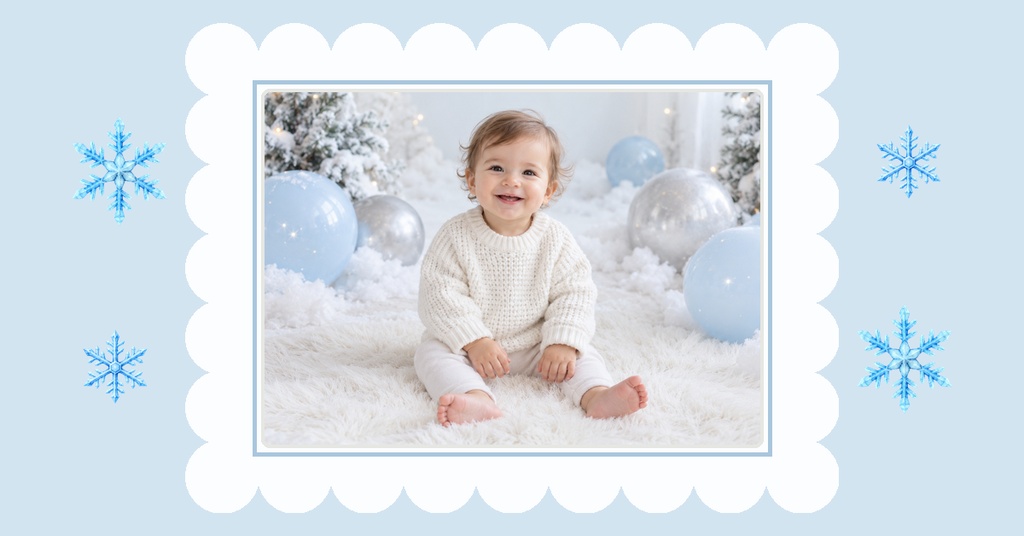 Baby sitting in a snowy winter scene with blue balloons, framed by a scalloped white border and snowflakes.