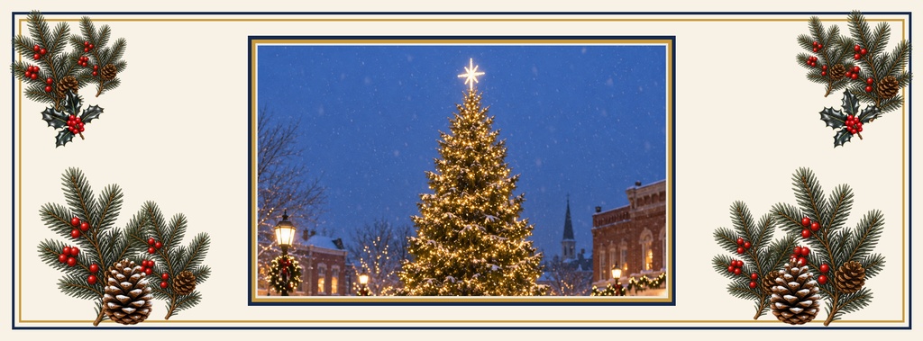 Lit Christmas tree on a town square framed by holiday greenery and berries