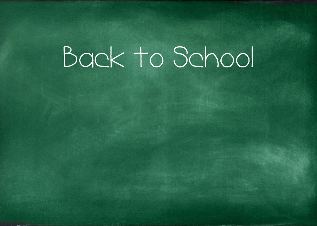 Green chalkboard with 'Back to School' written in white chalk