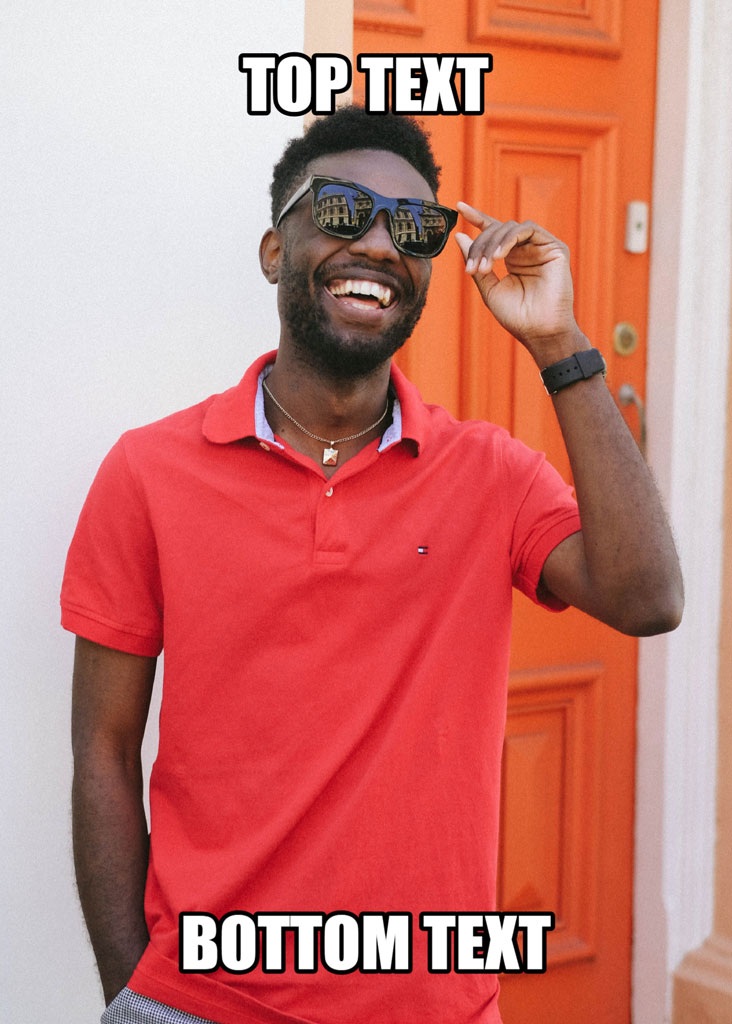 Man in red polo shirt and sunglasses standing in front of an orange door