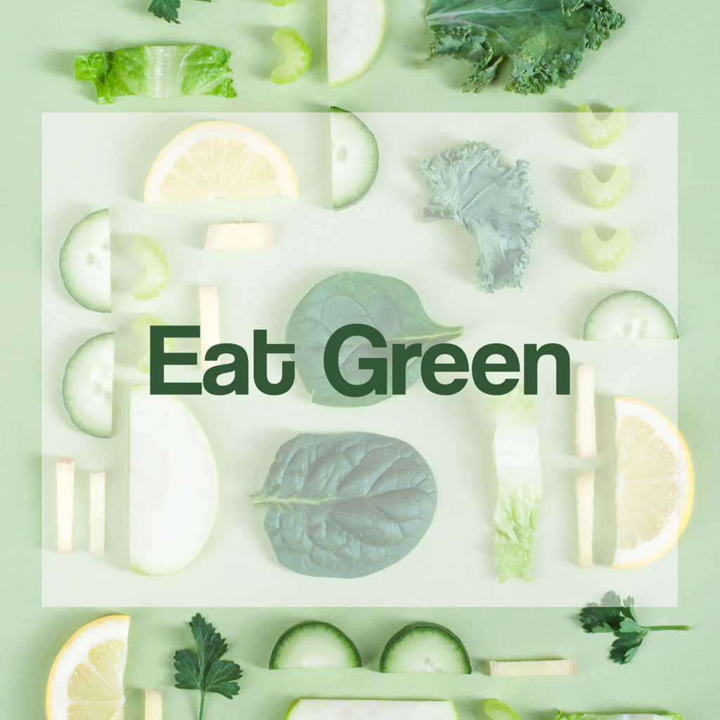 Assorted green vegetables and fruits with the text 'Eat Green'