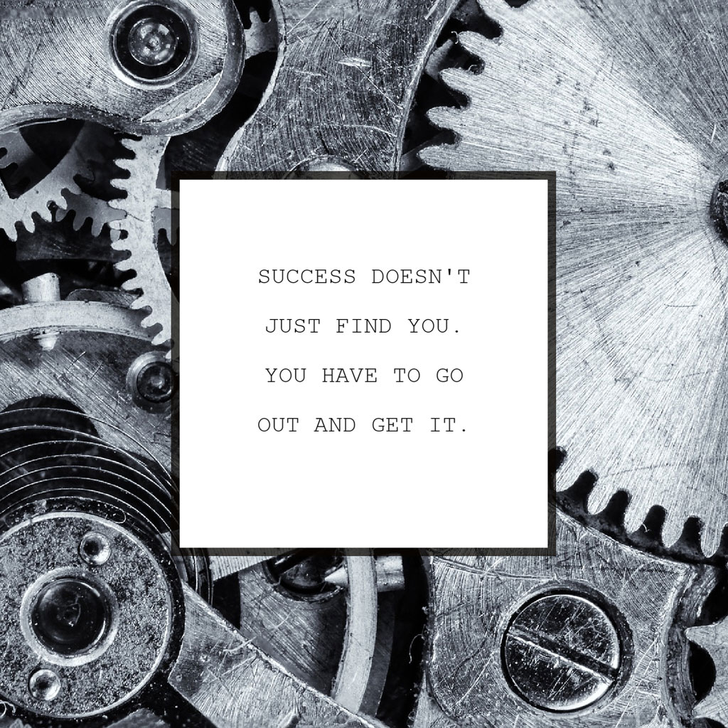 Motivational quote on a white square overlaying a background of mechanical gears.