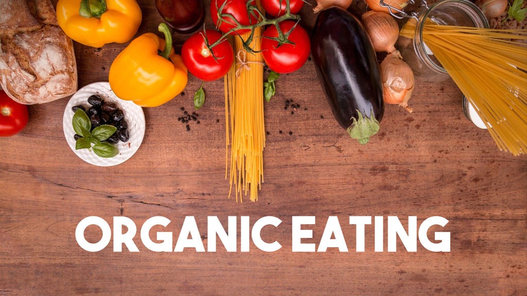 Assorted organic vegetables and pasta on a wooden table