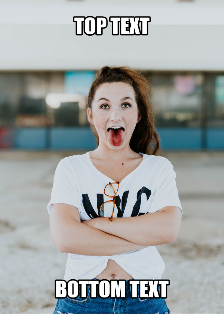A woman with her mouth open in shock, wearing a white t-shirt and blue jeans, with arms crossed.