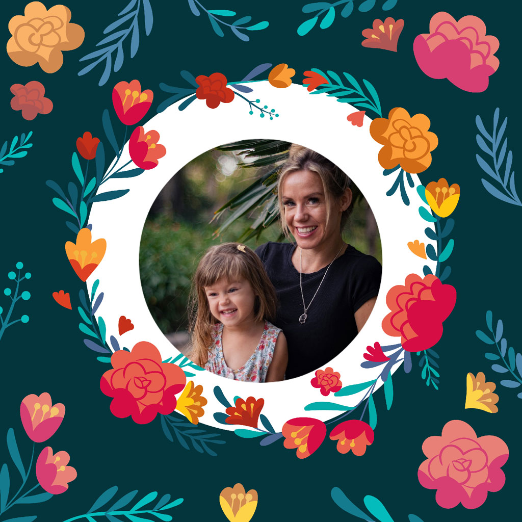 A mother and daughter smiling together in a floral frame.