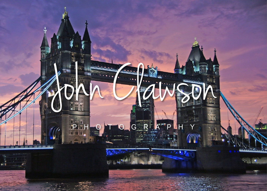 Tower Bridge in London at sunset with a purple sky