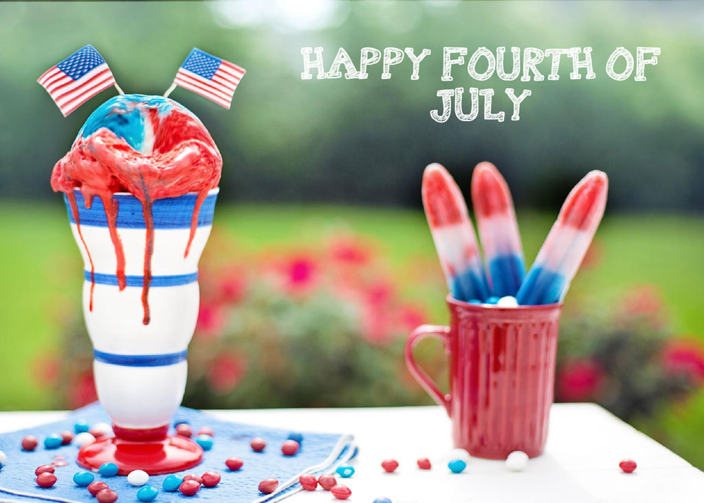 Red, white, and blue dessert with American flags on top