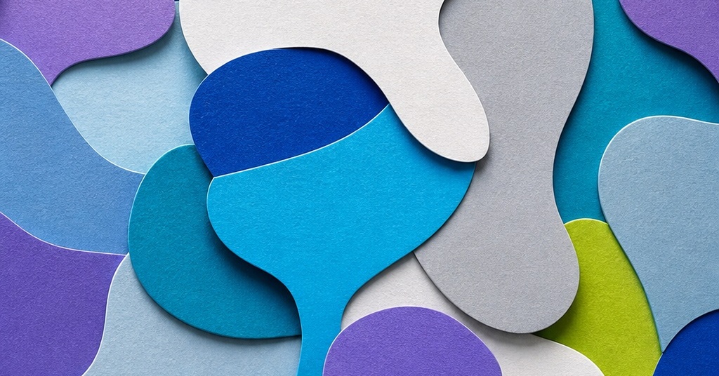 Abstract layered paper shapes in blue, purple, white, and green on a light background
