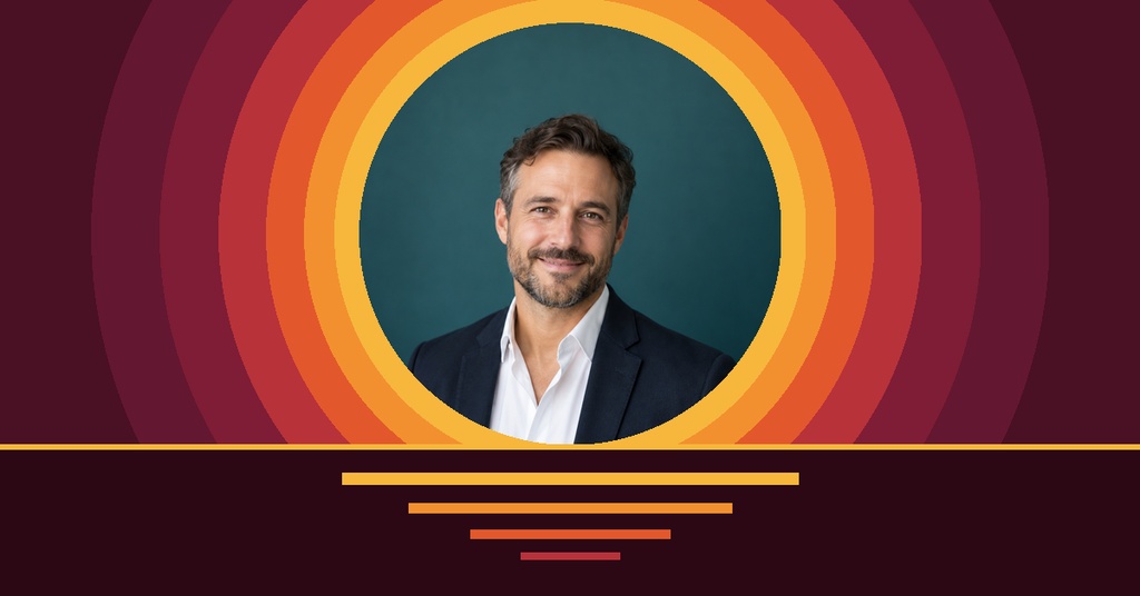 Portrait of a smiling man inside colorful circular rings on a burgundy landscape cover design.