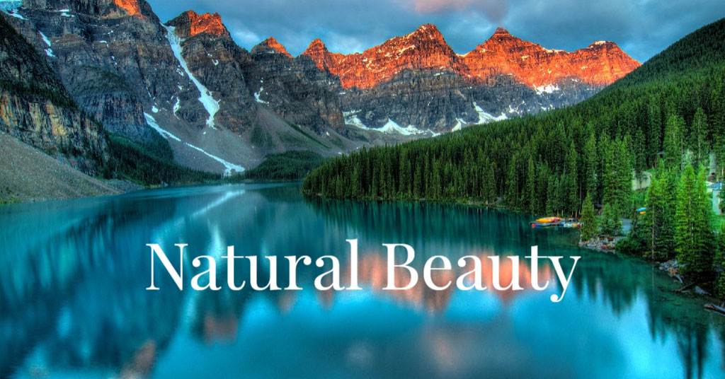 A tranquil lake with a mountain range in the background