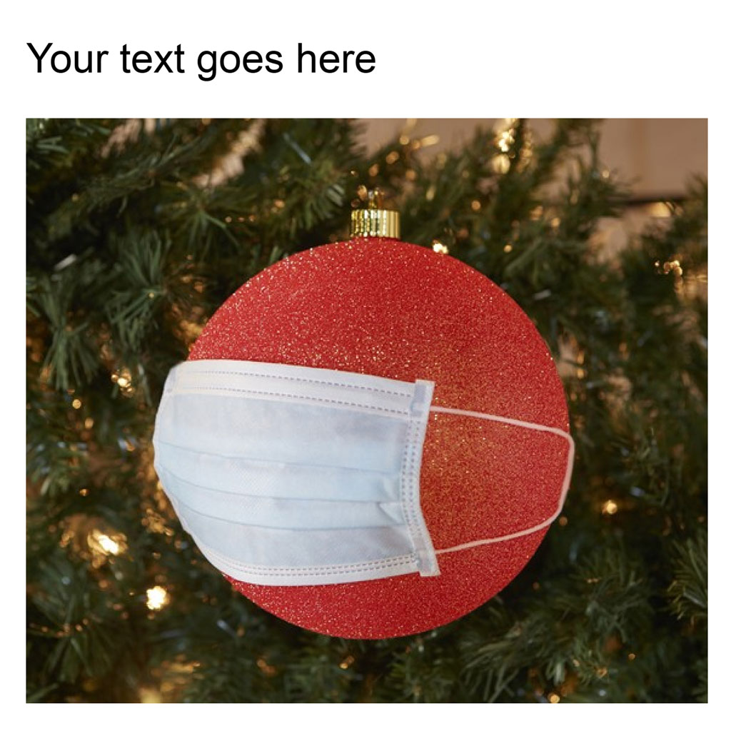 Red Christmas ornament with a face mask on a decorated tree