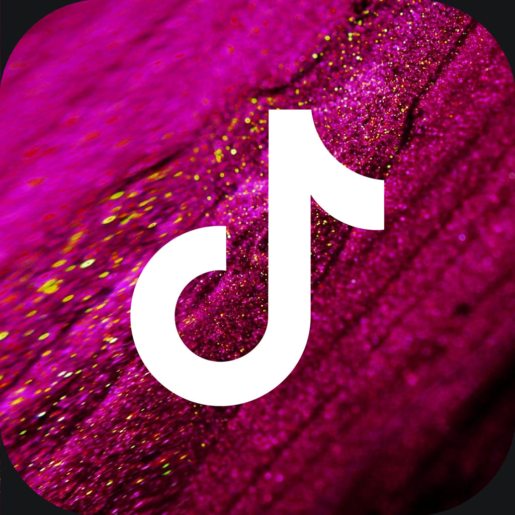 TikTok logo on a pink glittery surface
