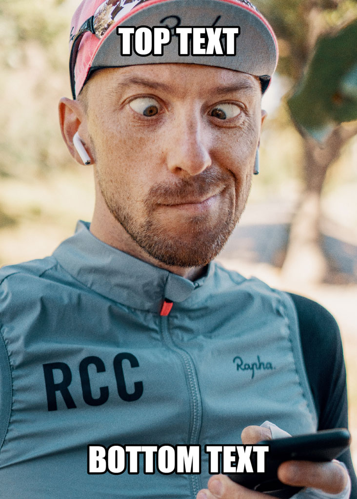 A man wearing a cycling jersey and cap, looking surprised while holding a phone.
